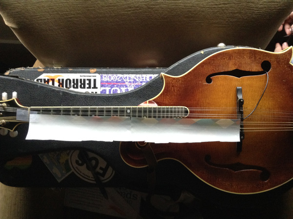 strip full length of mandolin