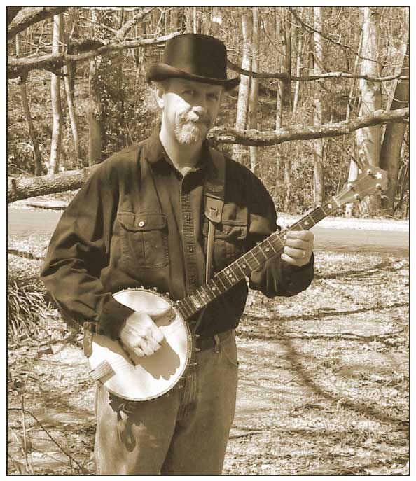 Ranger Brad Laird holding a banjo and wearing a stupid looking hat